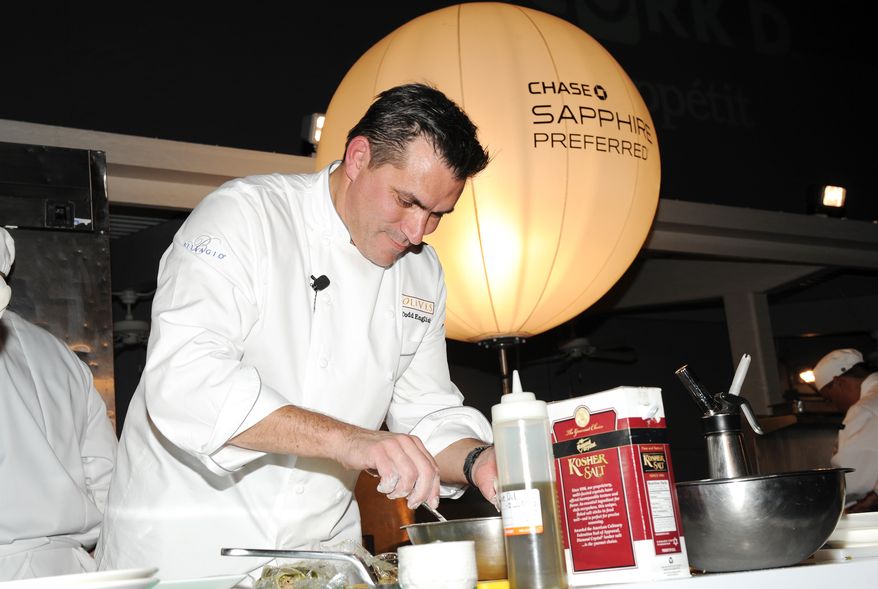 IMAGE DISTRIBUTED FOR CHASE SAPPHIRE - Chef Todd English participates in the Chase Sapphire Preferred Grill Challenge during Vegas Uncork&#39;d by Bon Appetit, at the Bellagio on Saturday, May 11, 2013 in Las Vegas. (Photo by Evan Agostini/Invision for Chase Sapphire/AP) **FILE**


