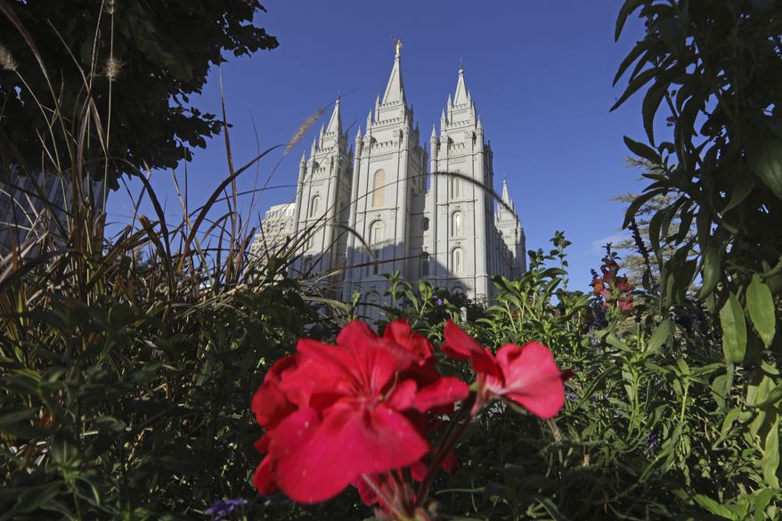 This Oct. 4, 2019, file photo, shows the Salt Lake Temple at Temple Square in Salt Lake City. The Church of Jesus Christ of Latter-day Saints has postponed a key meeting of top global leaders scheduled for April 1-2 because of the spread of the coronavirus around the world. The faith is also discouraging members from traveling from outside the United States for a twice-yearly conference set for the weekend of April 4-5 in Salt Lake City, the religion said in a news release Thursday, Feb. 27, 2020. (AP Photo/Rick Bowmer, File) **FILE**