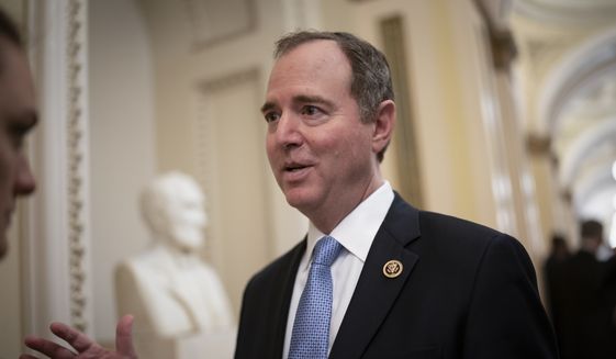 House Intelligence Committee Chairman Adam Schiff, D-Calif., talks to reporters as lawmakers work to extend government surveillance powers that are expiring soon, on Capitol Hill in Washington, Tuesday, March 3, 2020. (AP Photo/J. Scott Applewhite)