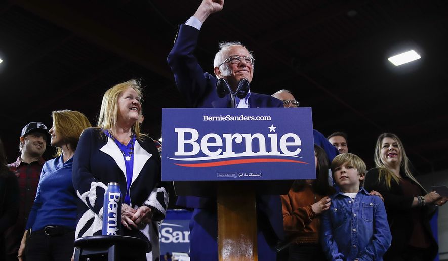 Democratic presidential candidate Sen. Bernie Sanders, I-Vt., accompanied by his wife Jane O'Meara Sanders and other family members speaks during a primary night election rally in Essex Junction, Vt., Tuesday, March 3, 2020. (AP Photo/Matt Rourke)