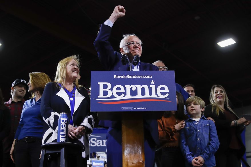 Democratic presidential candidate Sen. Bernie Sanders, I-Vt., accompanied by his wife Jane O'Meara Sanders and other family members speaks during a primary night election rally in Essex Junction, Vt., Tuesday, March 3, 2020. (AP Photo/Matt Rourke)