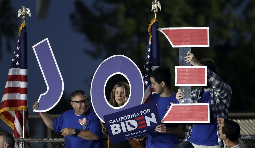 Supporters hold a sign before a campaign rally for Democratic presidential candidate former Vice President Joe Biden on Tuesday, March 3, 2020, in Los Angeles. (AP Photo/Marcio Jose Sanchez)
