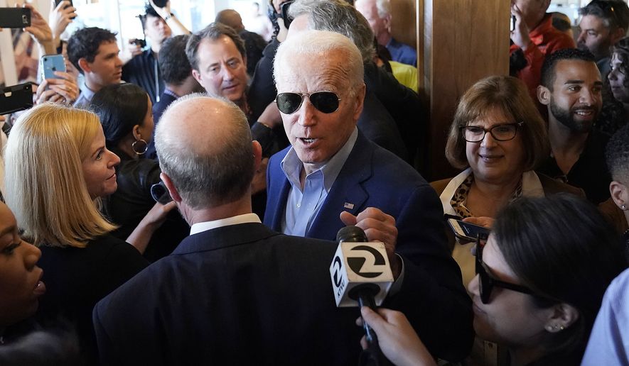 Democratic presidential candidate former Vice President Joe Biden greets customers at the Buttercup Diner during a campaign stop in Oakland, Calif., Tuesday, March 3, 2020. (AP Photo/Tony Avelar)