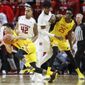 Maryland&#39;s Anthony Cowan Jr. (1) drives past Rutgers&#39; Jacob Young (42) during the second half of an NCAA college basketball game Tuesday, March 3, 2020, in Piscataway, N.J. (AP Photo/John Minchillo)