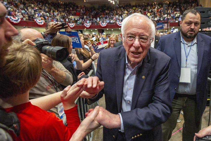 Democratic presidential candidate Sen. Bernie Sanders, I-Vt. leaves a campaign rally Monday, March 2, 2020, in St. Paul, Minn. (AP Photo/Andy Clayton-King)