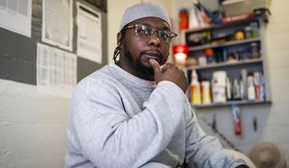 In this Feb. 13, 2020, photo, inmate Myon Burrell sits inside his cell at Minnesota Correctional Facility in Stillwater, Minn. Sentenced to life after a young black girl was killed by a stray bullet, Burrell&#39;s story has been told - and told again - by U.S. Sen. Amy Klobuchar while trumpeting her tough-on-crime record as a top Minneapolis prosecutor. But a year-long Associated Press investigation discovered major flaws and inconsistencies in the case, raising questions about whether the 16-year-old alleged shooter may have been wrongly convicted. (AP Photo/John Minchillo)