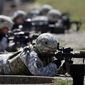 In this Sept. 18, 2012, photo, female soldiers from 1st Brigade Combat Team, 101st Airborne Division train on a firing range while testing new body armor in Fort Campbell, Ky. (AP Photo/Mark Humphrey) **FILE**
