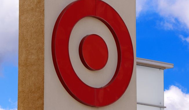 FILE- This May 3, 2017, file photo shows the Target logo on a store in Upper Saint Clair, Pa. Target reported strong fourth-quarter profits, though its sales were weighed down by weak toy and electronics sales during the crucial holiday shopping season.  Target joins a string of other retailers, including Walmart, with disappointing sales during the shortest holiday shopping period since 2013. (AP Photo/Gene J. Puskar, File)