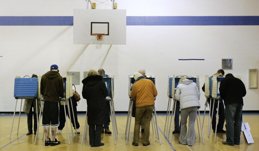 FILE – In this March 4, 2008, file photo, voters cast their ballots in Ohio's primary election at a polling station in the former Coventry Elementary School in Cleveland Heights, Ohio. A federal appeals court ruled Tuesday, March 3, 2020, that people who get jailed in Ohio don't get the same ability to vote late as people who are hospitalized unexpectedly. (AP Photo/Amy Sancetta, File)