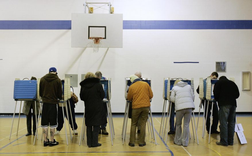 FILE – In this March 4, 2008, file photo, voters cast their ballots in Ohio's primary election at a polling station in the former Coventry Elementary School in Cleveland Heights, Ohio. A federal appeals court ruled Tuesday, March 3, 2020, that people who get jailed in Ohio don't get the same ability to vote late as people who are hospitalized unexpectedly. (AP Photo/Amy Sancetta, File)