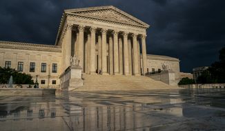 FILE - In this June 20, 2019 file photo, the Supreme Court is seen under stormy skies in Washington. The Supreme Court is taking up the first major abortion case of the Trump era, an election-year look at a Louisiana dispute that could reveal how willing the more conservative court is to roll back abortion rights. (AP Photo/J. Scott Applewhite, File)
