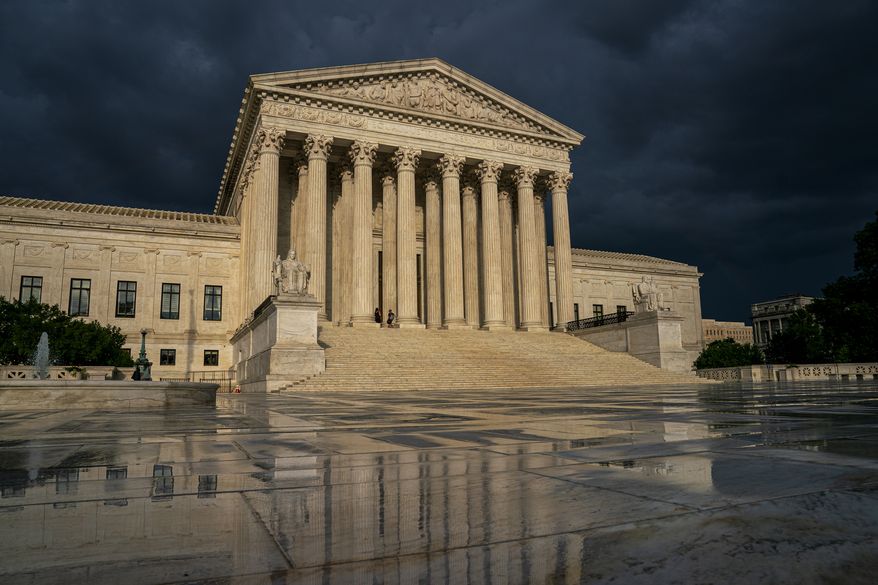 FILE - In this June 20, 2019 file photo, the Supreme Court is seen under stormy skies in Washington. The Supreme Court is taking up the first major abortion case of the Trump era, an election-year look at a Louisiana dispute that could reveal how willing the more conservative court is to roll back abortion rights. (AP Photo/J. Scott Applewhite, File)