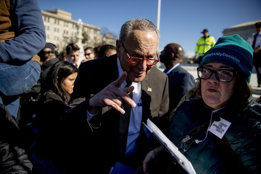 Senate Minority Leader Sen. Chuck Schumer of N.Y. arrives to speak to abortion rights demonstrators at a rally outside the Supreme Court, in Washington, Wednesday, March 4, 2020, as the court takes up the first major abortion case of the Trump era Wednesday, an election-year look at a Louisiana dispute that could reveal how willing the more conservative court is to roll back abortion rights. (AP Photo/Andrew Harnik)