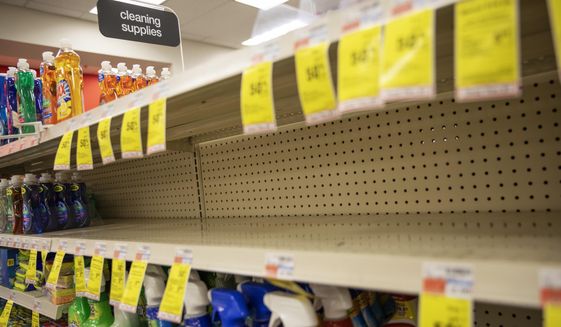 Shelves where disinfectant wipes and sprays are usually displayed sit empty in a pharmacy Wednesday, March 4, 2020, in Providence, R.I., as confirmed cases of the coronavirus rise in the U.S. (AP Photo/David Goldman)