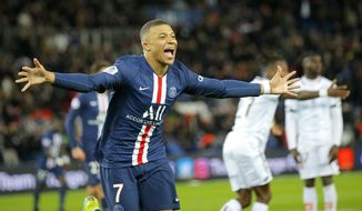 PSG&#39;s Kylian Mbappe celebrates after scoring his side&#39;s fourth goal during the French League One soccer match between Paris-Saint-Germain and Dijon, at the Parc des Princes stadium in Paris, France, Saturday, Feb. 29, 2020. (AP Photo/Michel Euler)