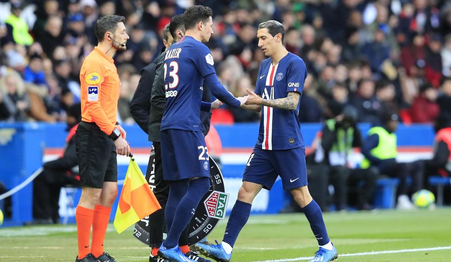 PSG's Angel Di Maria, right, walks off after being substituted by PSG's Julian Draxler during the French League One soccer match between Paris-Saint-Germain and Dijon, at the Parc des Princes stadium in Paris, France, Saturday, Feb. 29, 2020. (AP Photo/Michel Euler)
