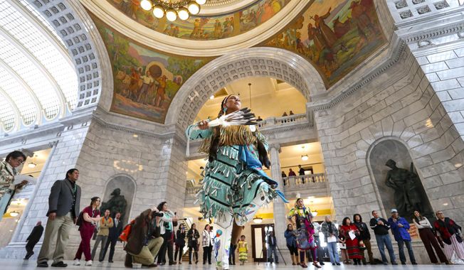 Tayler Gutierrez, of Sandy, and a member of the Cherokee and Blackfeet nations, performs the Jingle Dress dance during an event to raise awareness for HB116 in the Capitol rotunda in Salt Lake City on Tuesday, March 3, 2020. The bill would create a Murdered and Missing Indigenous Women and Girls Task Force. (Steve Griffin/The Deseret News via AP)