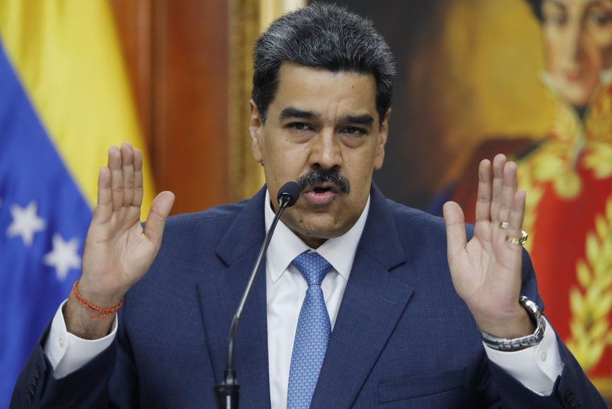 FILE - In this Feb. 14, 2020 file photo, Venezuelan President Nicolas Maduro gives a press conference at Miraflores presidential palace in Caracas, Venezuela. Maduro said on Tuesday, March 4, 2020, that he wants Venezuelan women to have many children as a way to boost the country, which has seen millions of people flee in recent years to escape its economic crisis. (AP Photo/Ariana Cubillos, File)