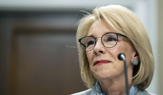 Education Secretary Betsy DeVos pauses as she testifies on Capitol Hill in Washington, during a hearing of the House Appropriations Sub-Committee on Labor, Health and Human Services, Education, and Related Agencies on the fiscal year 2021 budget. (AP Photo/Alex Brandon, File)