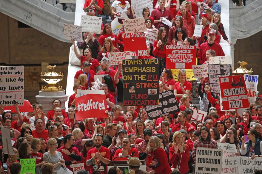 In this Feb. 28, 2020, photo, teachers from the Salt Lake City School District are shown during a rally at the Utah State Capitol. Income tax money can only be used for education in Utah, but lawmakers are now introducing a complex proposal to change that in hopes of shoring up the state's shrinking sales-tax base. The proposal announced Wednesday, March 4, 2020, by legislative leaders would allow income tax to be used for other needs of children and the disabled as well as education, the Deseret News reported. (AP Photo/Rick Bowmer)