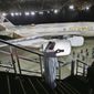 FILE- In this Thursday, Dec. 18, 2014 file photo, an Emirati man takes a selfie in front of a new Etihad Airways A380 in Abu Dhabi, United Arab Emirates. Abu Dhabi&#39;s long-troubled national carrier Etihad on Thursday, March 5, 2020, reported losses of $870 million in 2019 after losing billions in recent years, calling the result &amp;quot;encouraging.&amp;quot; (AP Photo/Kamran Jebreili, File)