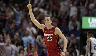 Miami Heat forward Duncan Robinson celebrates after scoring during the second half of the team&#39;s NBA basketball game against the Orlando Magic, Wednesday, March 4, 2020, in Miami. (AP Photo/Wilfredo Lee)