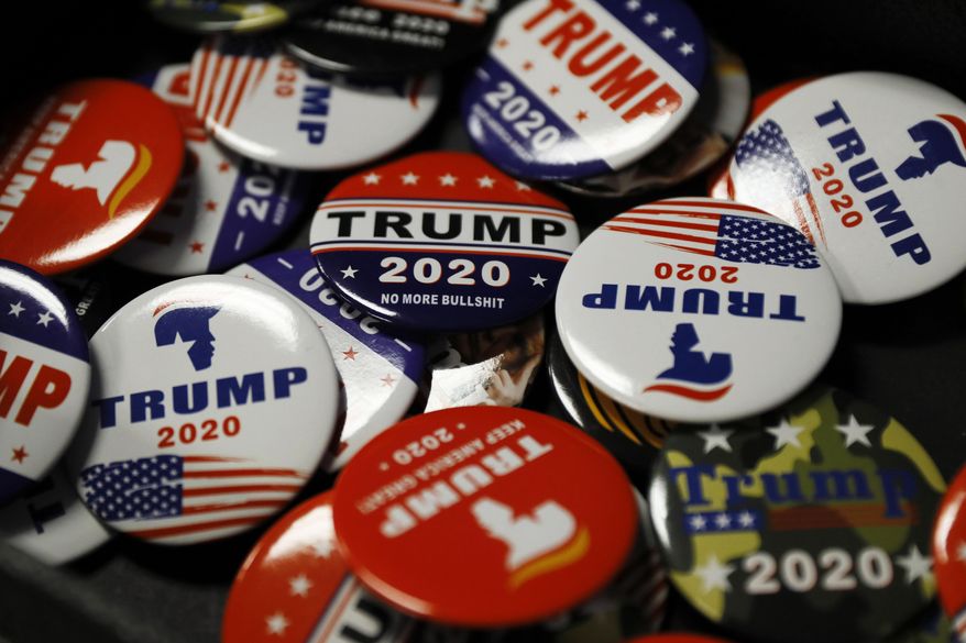 In this Thursday, Feb. 13, 2020 file photo, buttons are seen at The Trump Store in Bensalem, Pa. The shop selling President Donald Trump-themed merchandise in a strip mall in suburban Philadelphia has emerged as a magnet for the president’s backers and a reflection of Pennsylvania’s status as a political battleground this year. (AP Photo/Matt Slocum) ** FILE **
