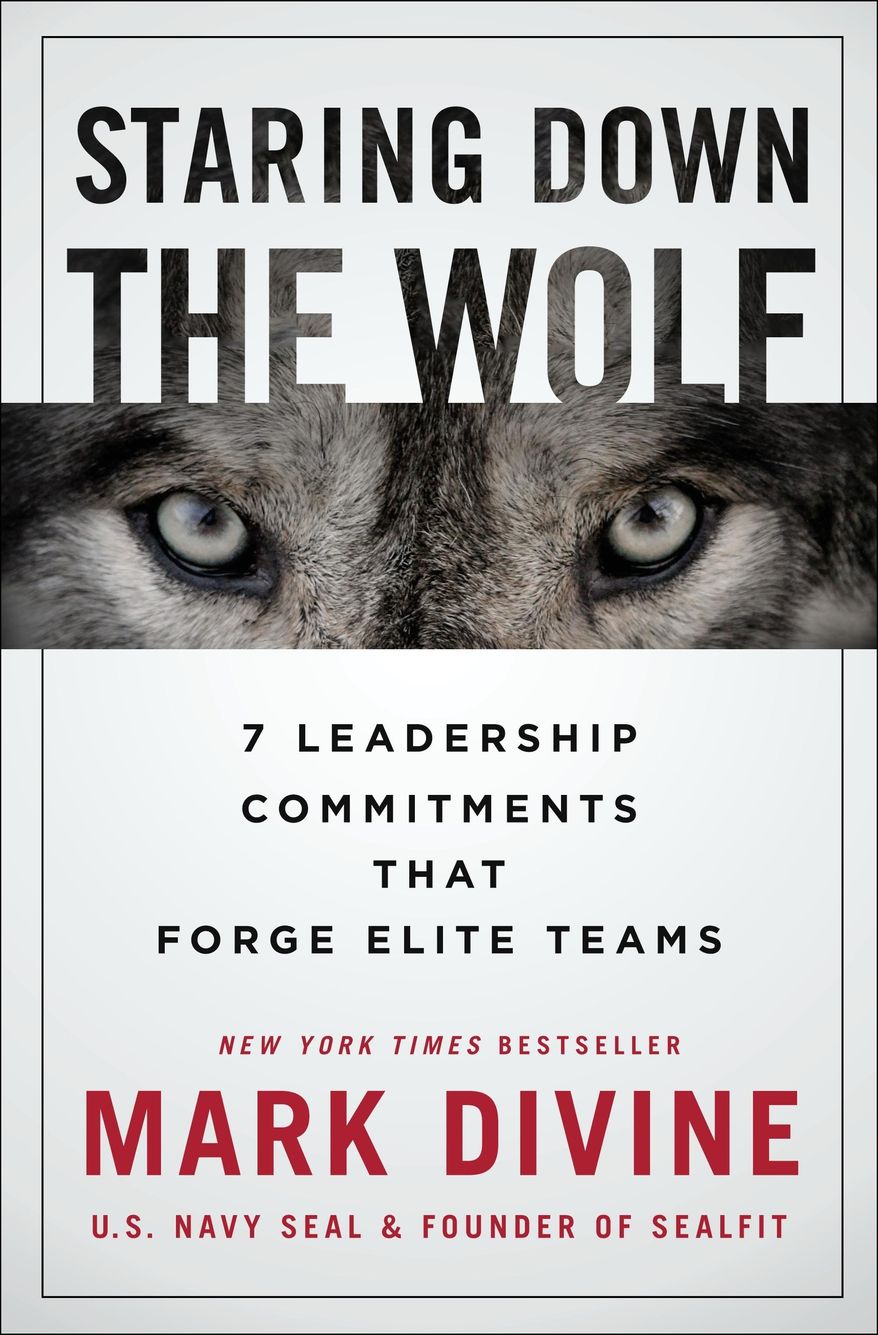 This cover image released by St. Martin's Press shows "Staring Down the Wolf: 7 Leadership Commitments That Forge Elite Teams" by Mark Divine. (St. Martin's Press via AP)
