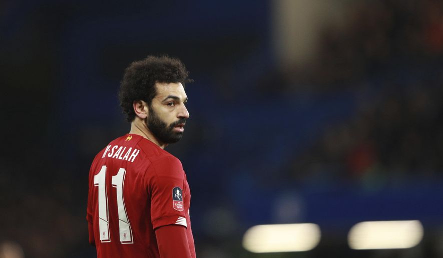 Liverpool's Mohamed Salah reacts during the English FA Cup fifth round soccer match between Chelsea and Liverpool at Stamford Bridge stadium in London Tuesday, March 3, 2020. (AP Photo/Ian Walton)