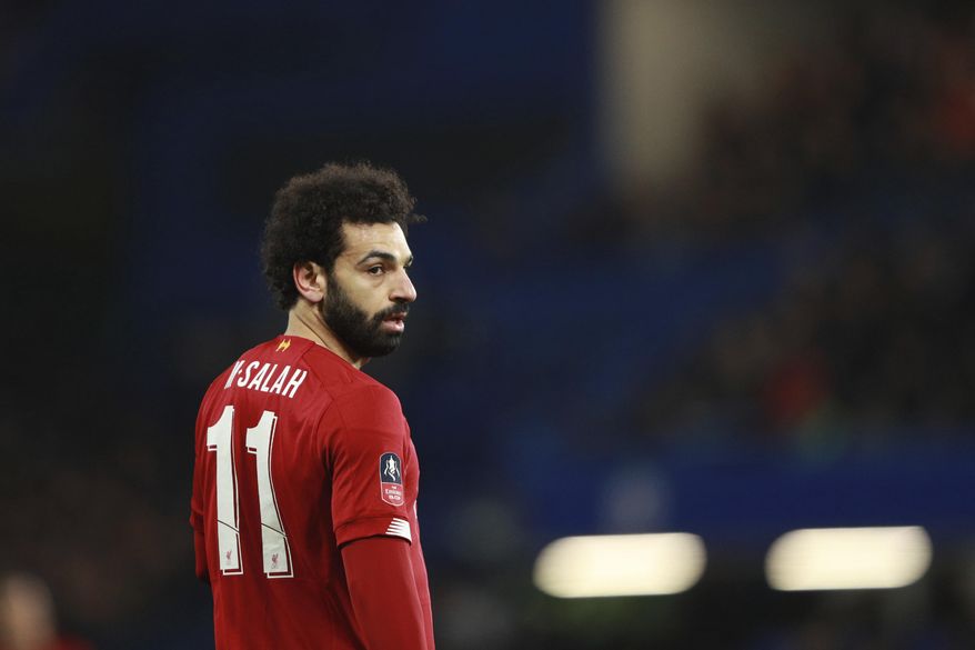 Liverpool's Mohamed Salah reacts during the English FA Cup fifth round soccer match between Chelsea and Liverpool at Stamford Bridge stadium in London Tuesday, March 3, 2020. (AP Photo/Ian Walton)