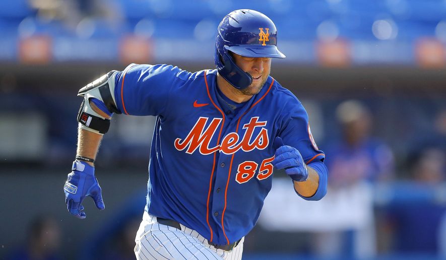 New York Mets' Tim Tebow runs out a ground out against the St. Louis Cardinals during the eighth inning of a spring training baseball game, Wednesday, March 4, 2020, in Port St. Lucie, Fla. (AP Photo/Julio Cortez)