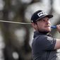 CORRECTS SPELLING TO TYRRELL, INSTEAD OF TYRELL - Tyrrell Hatton, of England, watches his shot from the seventh tee during the second round of the Arnold Palmer Invitational golf tournament Friday, March 6, 2020, in Orlando, Fla. (AP Photo/John Raoux)