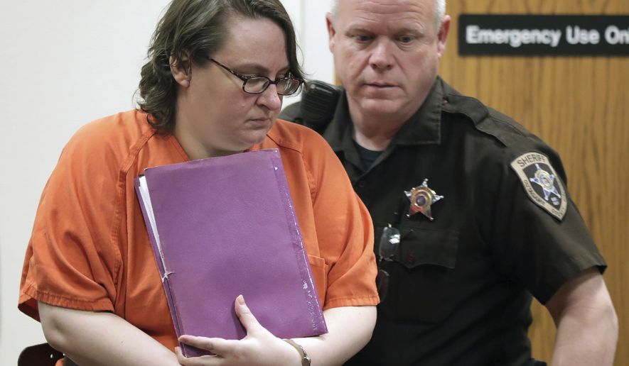 Nicole Gussert enters the courtroom during sentencing in her trial at the Outagamie County Justice Center in Appleton, Wis., on Thursday, March 5, 2020. Gussert was convicted of neglecting her 13-year-old disabled daughter and causing her death has been sentenced to 17 years in prison. (Wm. Glasheen/The Post-Crescent via AP)