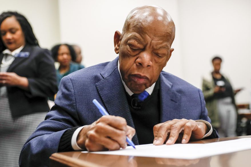 Congressman John Lewis signs paperwork to qualify for reelection to his District 5 seat in Atlanta, Monday, March 2, 2020. Georgia's political season kicks into high gear Monday as qualifying for state and federal offices begins. (Bob Andres/Atlanta Journal-Constitution via AP)
