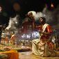 Hindu devotees watch as priests perform rituals during a prayer ceremony dedicated to holy river Ganges in Varanasi, India, Friday, March 6, 2020. India is bracing for a potential explosion of coronavirus cases as authorities rush to trace, test and quarantine contacts of 31 people confirmed to have the disease. Prime Minister Narendra Modi&#39;s government said last week that community transmission is now taking place. India has shut schools, stopped exporting key pharmaceutical ingredients and urged state governments to cancel public festivities for Holi, the Hindu springtime holiday in which people douse each other with colored water and paint. (AP Photo/Rajesh Kumar Singh)
