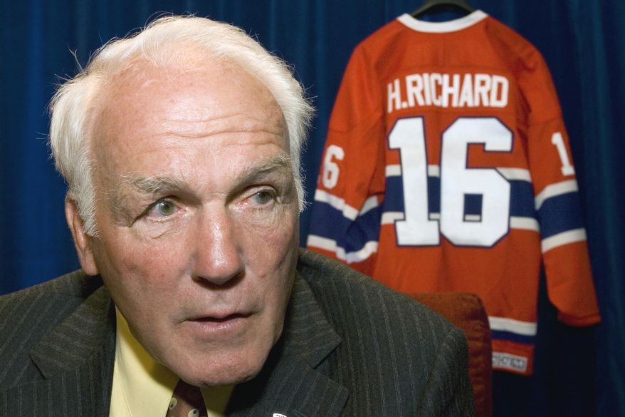 FILE - In this June 1, 2007, file photo, former Montreal Canadiens&#x27; Henri Richard responds to questions in Ottawa, Ontario. Henri Richard, the speedy center who won a record 11 Stanley Cups with the Montreal Canadiens, died Friday, March 6, 2020. He was 84. His death was announced by the team. Richard had Alzheimer&#x27;s disease. (Paul Chiasson, Canadian Press via AP)