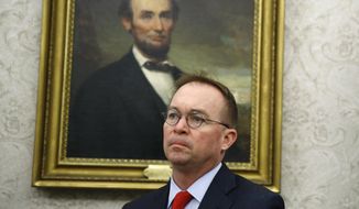 In this Nov. 13, 2019, file photo, then-acting Chief of Staff Mick Mulvaney listens as President Donald Trump and Turkish President Recep Tayyip Erdogan meet in the Oval Office with Republican senators at the White House in Washington. (AP Photo/Patrick Semansky, File)