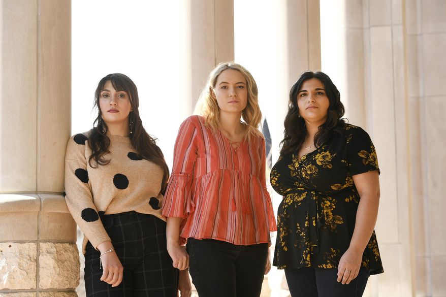 In this Feb. 26, 2020 photo, University of Denver students, from left, Madeline Membrino, Grace Wankelman and Shannon Saul pose for a portrait outside of the library at the university campus in Denver. The trio, who are all survivors of sexual assault, started an Instagram account called WecanDUbetter where DU students can anonymously share their stories of sexual assault on their college campus. The account has been so successful that they have started a second national account called The Do Better Campaign that they hope will target students on all college campuses nationwide. (Helen H. Richardson/The Denver Post via AP)