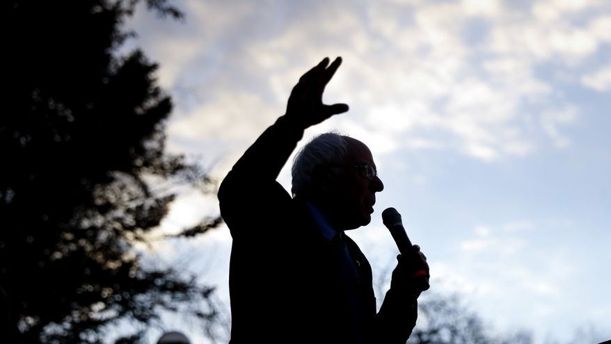 Rep. Alexandria Ocasio-Cortez , D-NY., Democratic presidential candidate Sen. Bernie Sanders, I-Vt., speaks during a campaign rally at the University of Michigan in Ann Arbor, Mich., Sunday, March 8, 2020. (AP Photo/Paul Sancya)