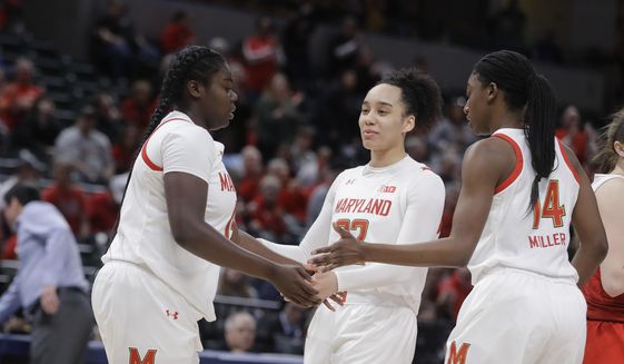 Maryland&#39;s Ashley Owusu (15) reacts to Blair Watson (22) and Diamond Miller (14) after Owusu hit a shot and was fouled during the first half of an NCAA college basketball championship game against Ohio State at the Big Ten Conference tournament, Sunday, March 8, 2020, in Indianapolis. (AP Photo/Darron Cummings)