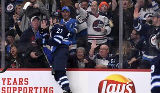 Winnipeg Jets&#39; Nikolaj Ehlers (27) celebrates his goal against the Arizona Coyotes during second-period NHL hockey game action in Winnipeg, Manitoba, Monday, March 9, 2020. (Fred Greenslade/The Canadian Press via AP)