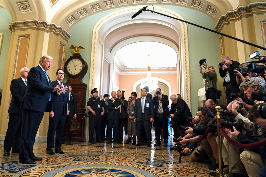 Vice President Mike Pence, Treasury Secretary Steven Mnuchin and President Trump face the press about coronavirus. (Associated Press)