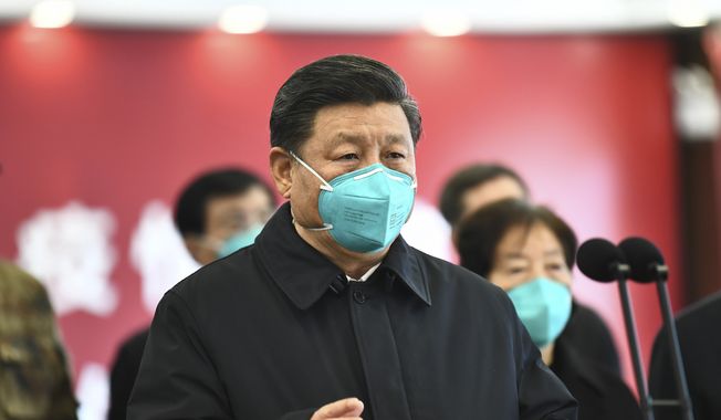 In this photo released by China&#x27;s Xinhua News Agency, Chinese President Xi Jinping talks by video with patients and medical workers at the Huoshenshan Hospital in Wuhan in central China&#x27;s Hubei Province, Tuesday, March 10, 2020. China&#x27;s president visited the center of the global virus outbreak Tuesday as Italy began a sweeping nationwide travel ban and people worldwide braced for the possibility of recession. For most people, the new coronavirus causes only mild or moderate symptoms, such as fever and cough. For some, especially older adults and people with existing health problems, it can cause more severe illness, including pneumonia. (Xie Huanchi/Xinhua via AP) **FILE**