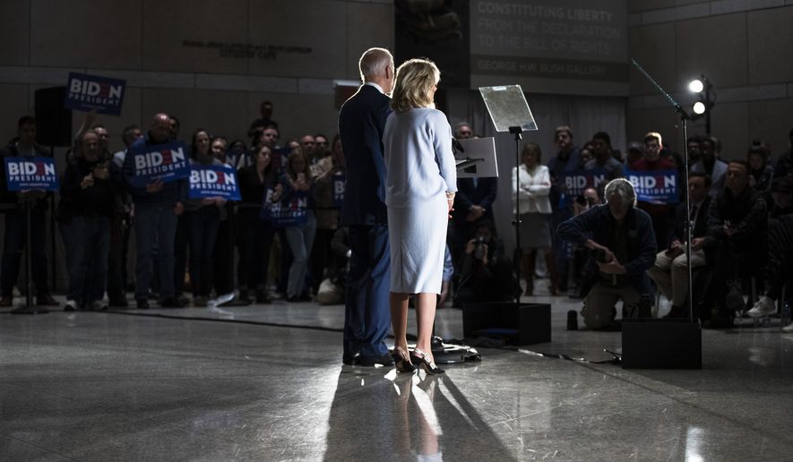 Democratic presidential candidate former Vice President Joe Biden, accompanied by his wife Jill, speaks to members of the press at the National Constitution Center in Philadelphia, Tuesday, March 10, 2020. (AP Photo/Matt Rourke)