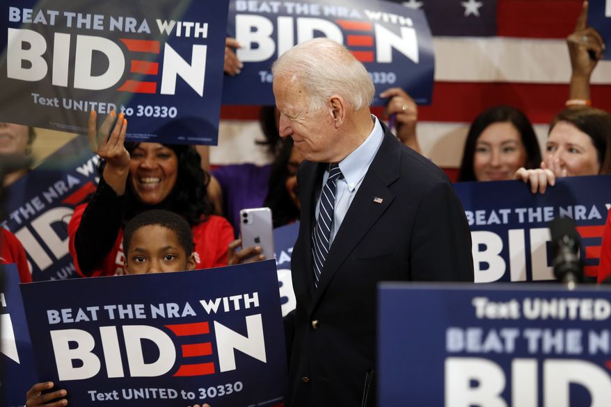 Democratic presidential candidate former Vice President Joe Biden enters a campaign event in Columbus, Ohio, Tuesday, March 10, 2020. (AP Photo/Paul Vernon)