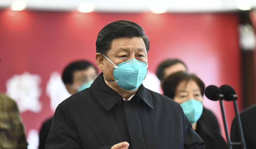 In this photo released by China&#x27;s Xinhua News Agency, Chinese President Xi Jinping talks by video with patients and medical workers at the Huoshenshan Hospital in Wuhan in central China&#x27;s Hubei Province, Tuesday, March 10, 2020. China&#x27;s president visited the center of the global virus outbreak Tuesday as Italy began a sweeping nationwide travel ban and people worldwide braced for the possibility of recession. For most people, the new coronavirus causes only mild or moderate symptoms, such as fever and cough. For some, especially older adults and people with existing health problems, it can cause more severe illness, including pneumonia. (Xie Huanchi/Xinhua via AP)