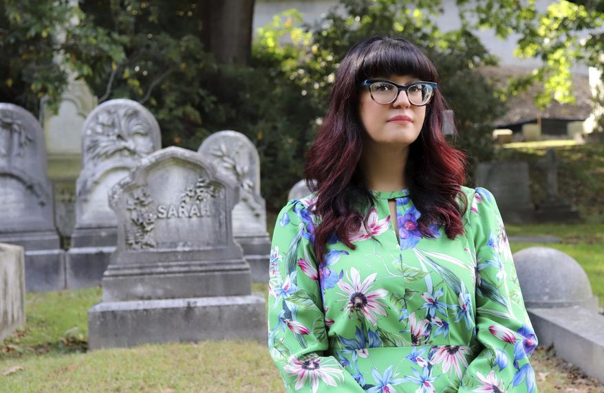 Sarah Chavez poses for a portrait on the grounds of Boston's historic Mount Auburn Cemetery during Death Salon, an event series hosted by The Order of the Good Death, in 2018. Instead of having her body buried or cremated, Chavez said she would opt to have her human remains turned into soil. Death is a natural process, and to Chavez, this would be not only environmentally friendly but also an act of resistance. (Bruno Huerta/RNS via AP)