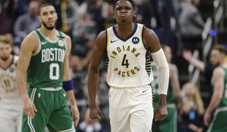 Indiana Pacers guard Victor Oladipo (4) reacts to making a shot late in the fourth quarter against the Boston Celtics in an NBA basketball game in Indianapolis, Tuesday, March 10, 2020. (AP Photo/AJ Mast)