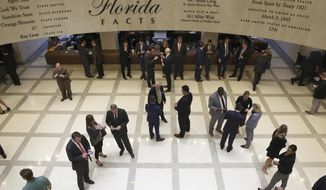 Lobbyists start to fill the fourth floor gallery between the House and Senate as session starts to consider the budget Tuesday March 10, 2020, in Tallahassee, Fla. (AP Photo/Steve Cannon)