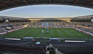 A view of the empty Dacia Arena stadium in Udine, Northern Italy, prior to the Italian Serie A soccer match between Udinese and Fiorentina, Sunday, March 8, 2020. Serie A played on Sunday despite calls from Italy’s sports minister and players’ association president to suspend the games in Italy’s top soccer division. (Andrea Bressanutti/LaPresse via AP)